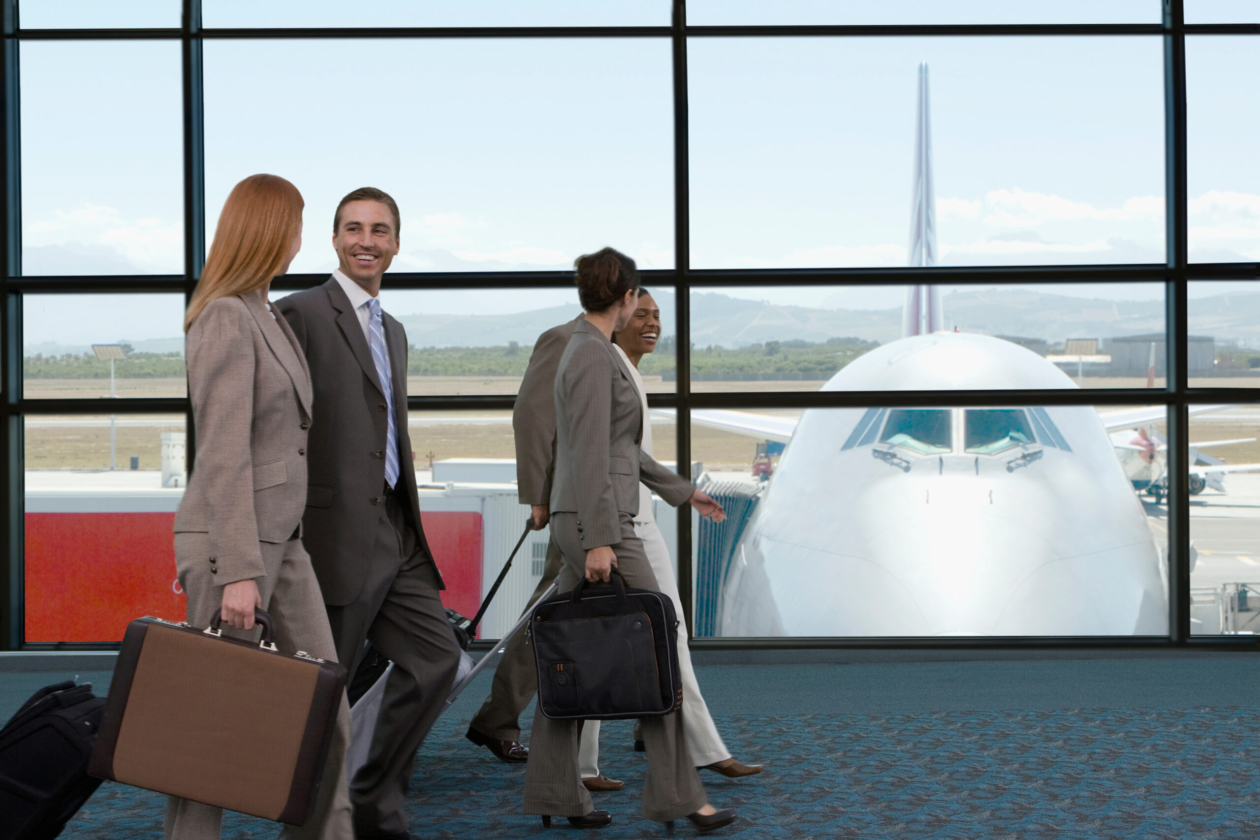 group-of-businesspeople-walking-to-their-departure-2025-10-15-05-09-15-utc